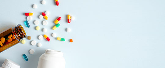 Prescription pills spilled on table